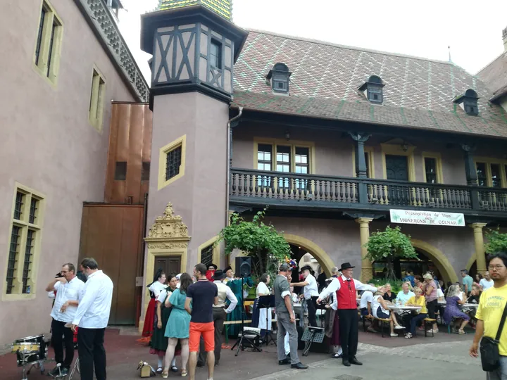 Folklore dancing in the evening at Colmar, Alsace (France)